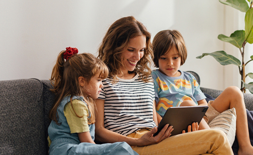 Mom with children using tablet